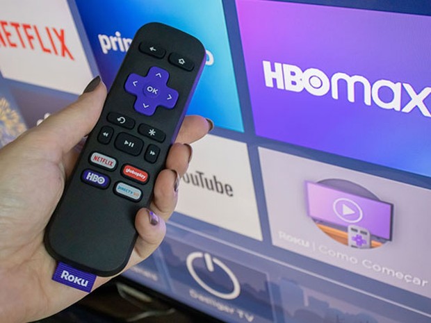Mando de la tele junto a una pantalla con HBO y Netflix
